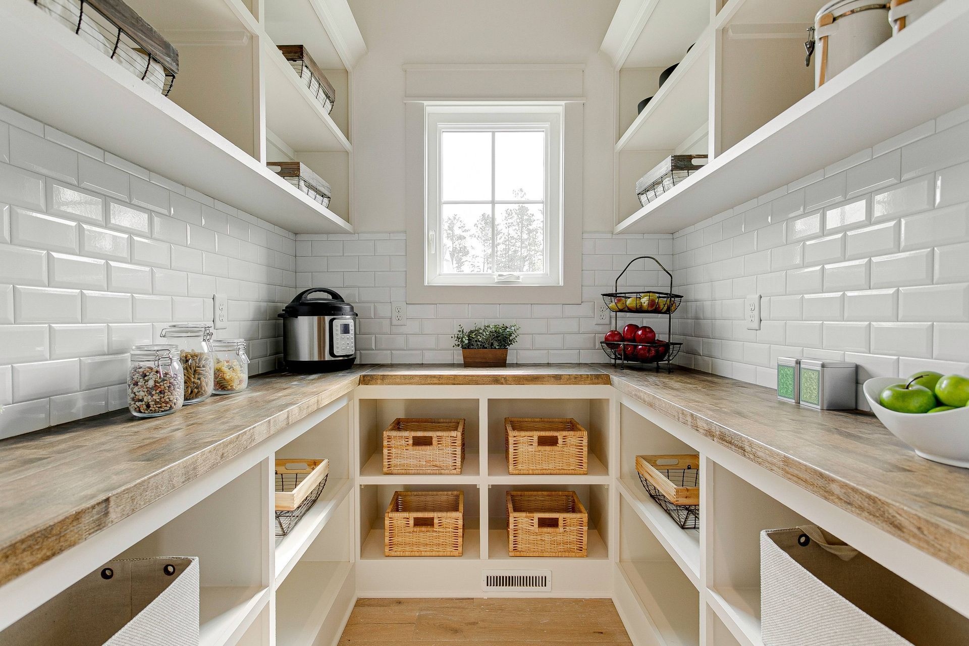 Modern walk-in pantry with open shelving and white backsplash