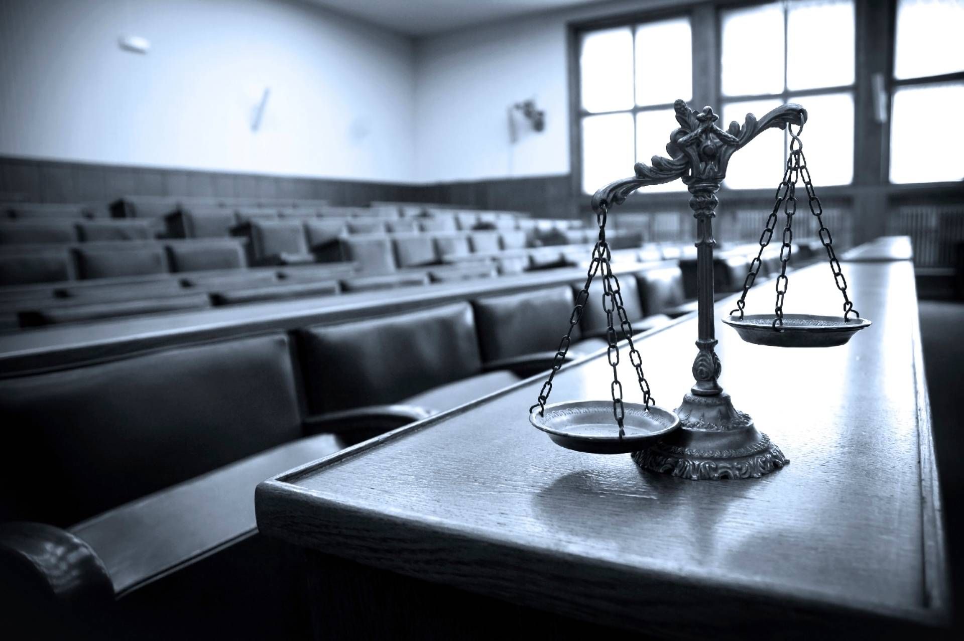 An image of the scales of justice in an empty courtroom near Lexington, Kentucky (KY)