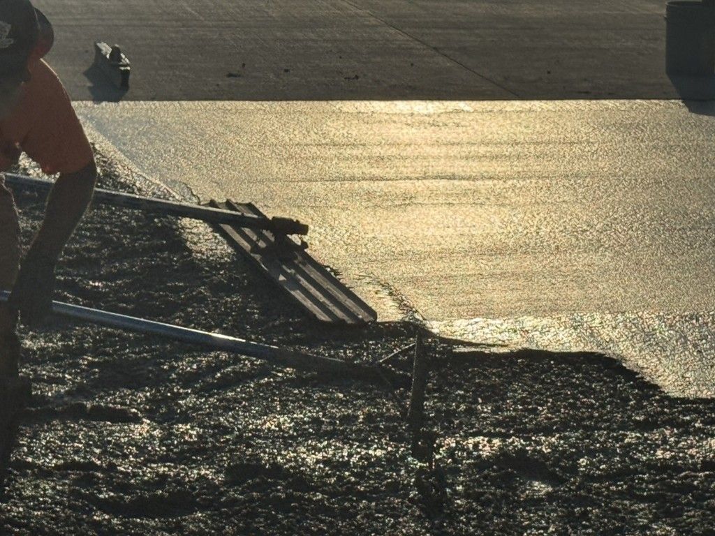 Yellow forklifts parked inside a warehouse with a concrete floor.