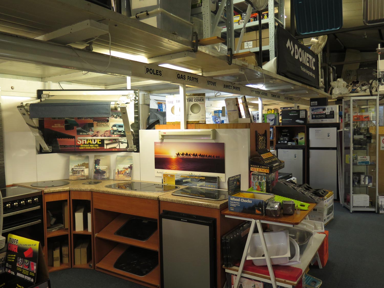 A kitchen in a store with a sign that says dometic on it
