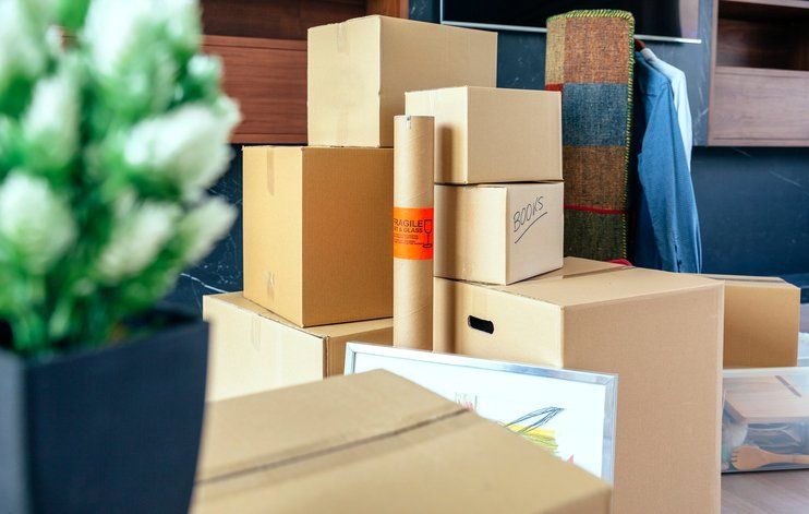 Image of packed boxes in a dorm room
