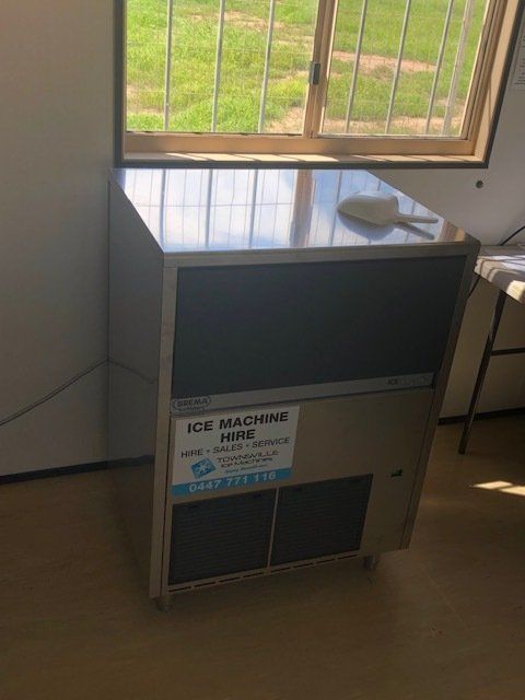 Ice Machine Standing Under a Window — Townsville Air-Conditioning In Idalia, QLD 4811