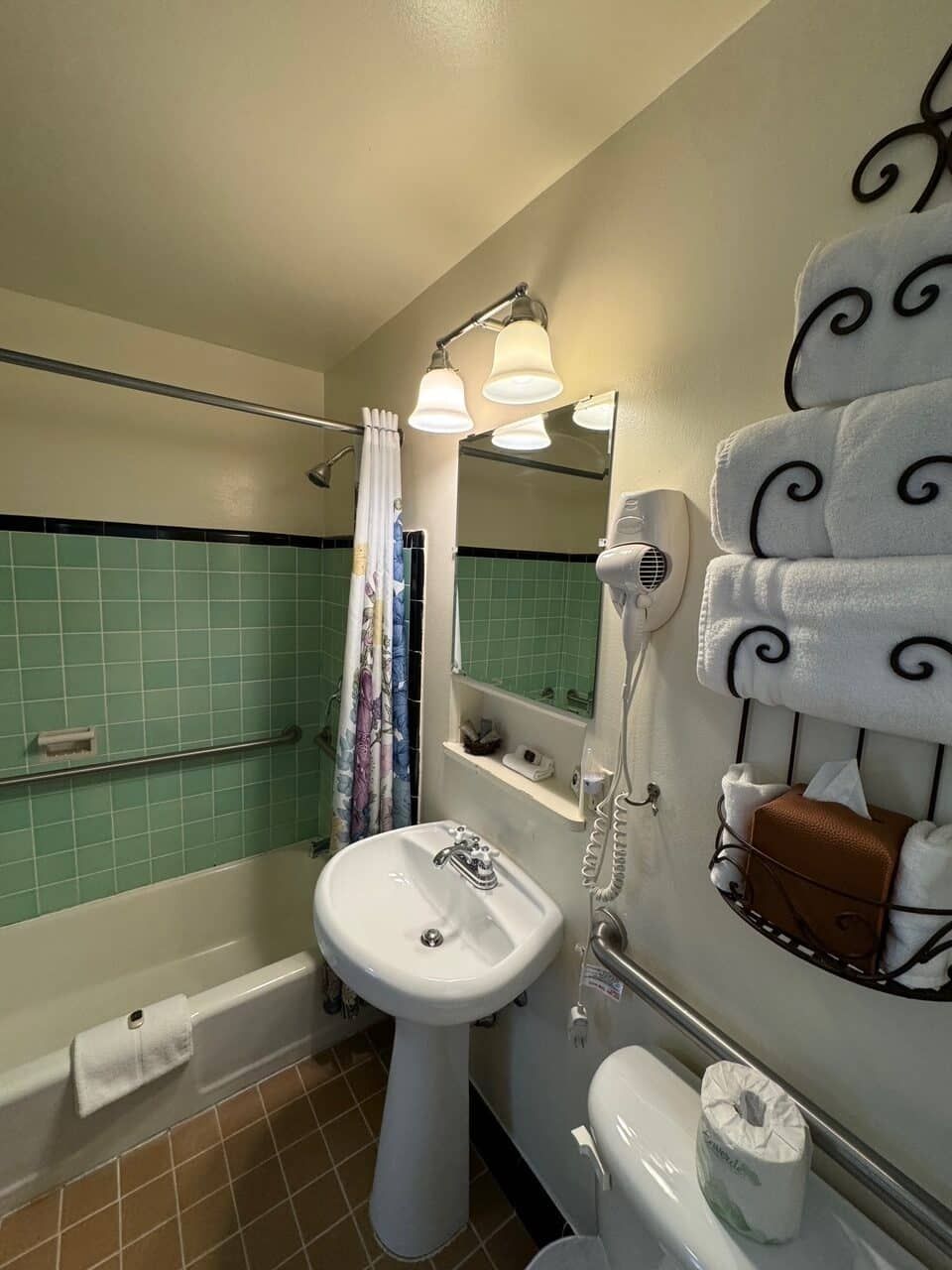 A bathroom with a sink a toilet and a bathtub