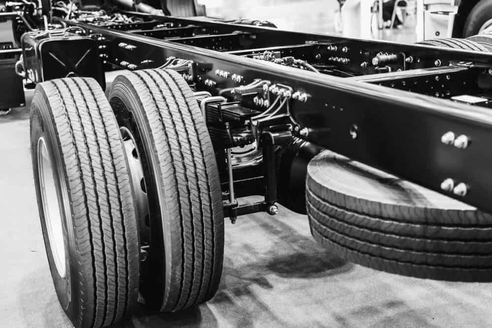 A Black and White Photo of A Truck 's Tires and Frame — BDM Heavy Vehicle Repairs In Wauchope, NSW