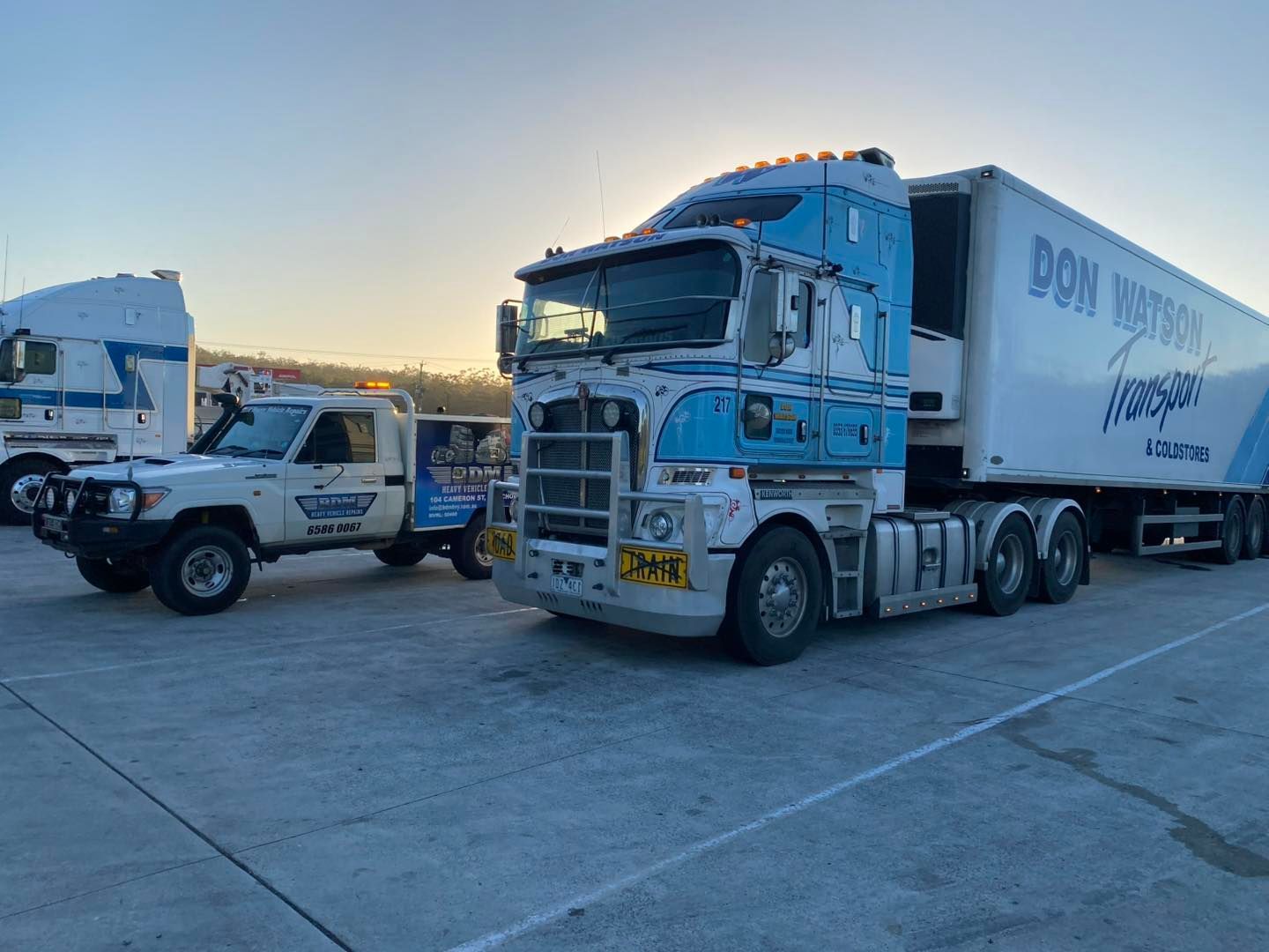 Two Semi Trucks Are Parked Next to Each Other in a Parking Lot — BDM Heavy Vehicle Repairs In Wauchope, NSW