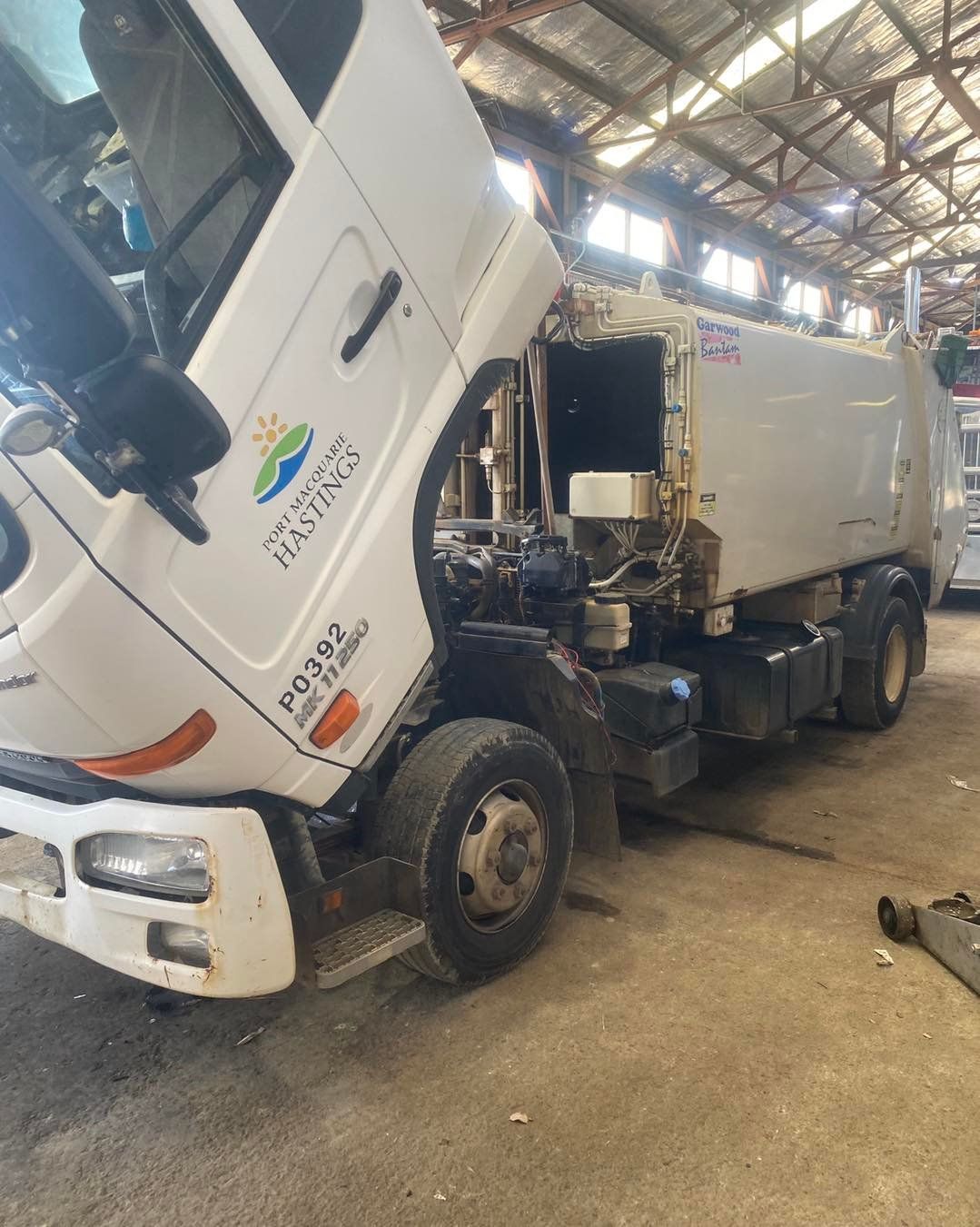 A White Semi Truck is Parked in a Garage — BDM Heavy Vehicle Repairs In Wauchope, NSW