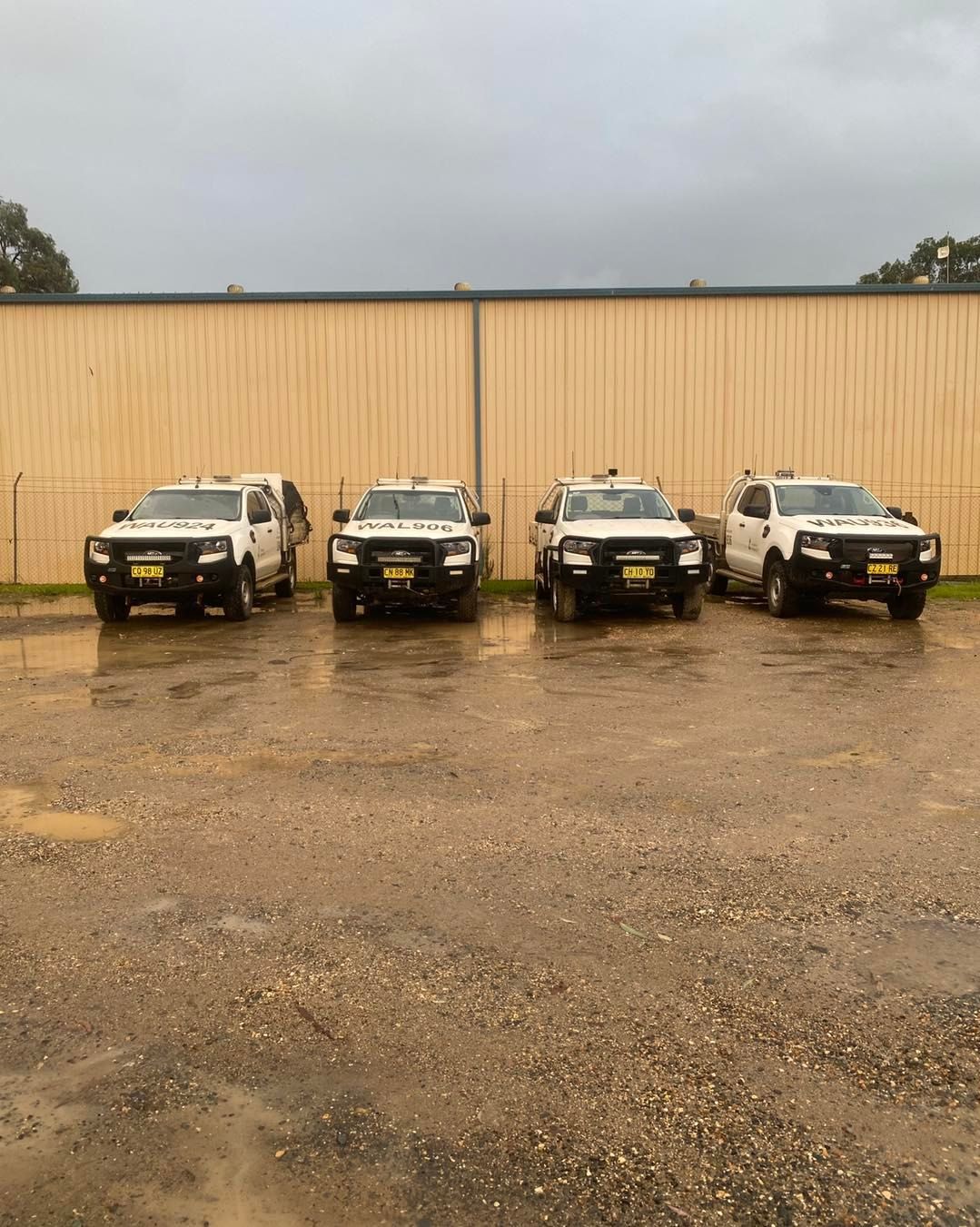 Four police vehicles are parked in a parking lot in front of a building.— BDM Heavy Vehicle Repairs In Wauchope, NSW