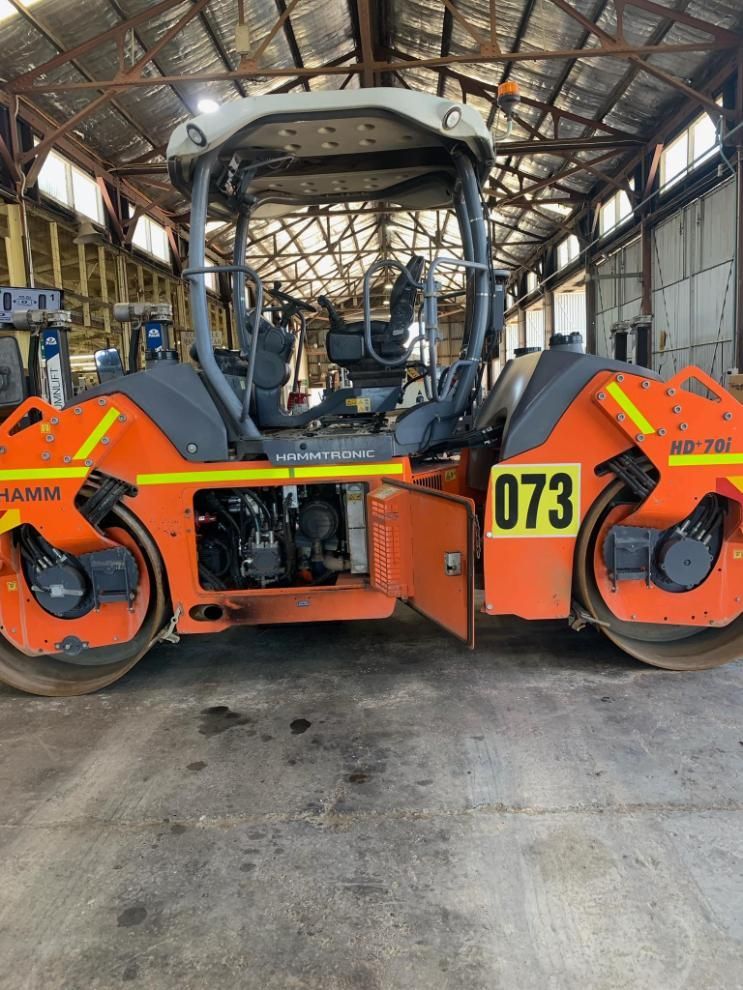 A Road Roller With the Number 073 on It is Parked in a Warehouse — BDM Heavy Vehicle Repairs In Wauchope, NSW