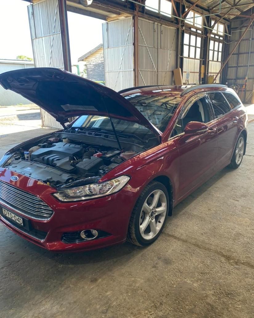 A Red Car with The Hood up Is Parked in A Garage — BDM Heavy Vehicle Repairs In Wauchope, NSW