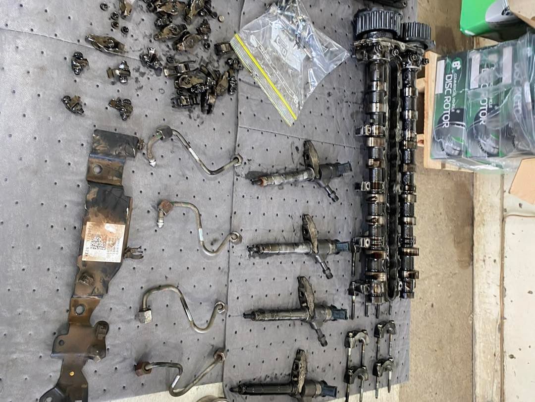 A Bunch of Metal Parts Are Sitting on a Table — BDM Heavy Vehicle Repairs In Wauchope, NSW