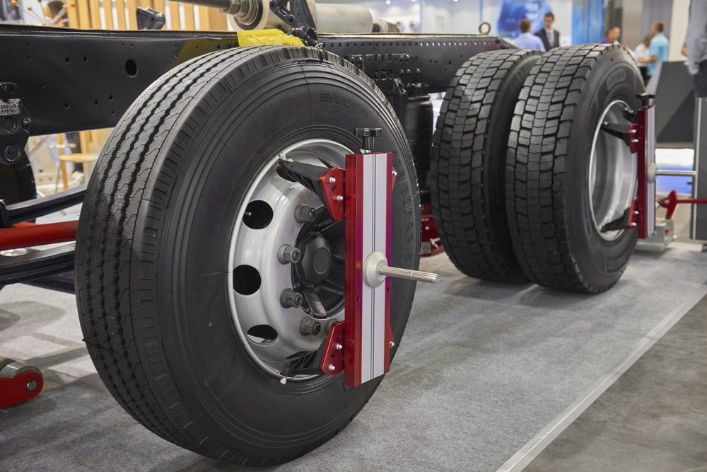 A Close up Of a Truck 's Tires on Display at A Convention — BDM Heavy Vehicle Repairs In Wauchope, NSW