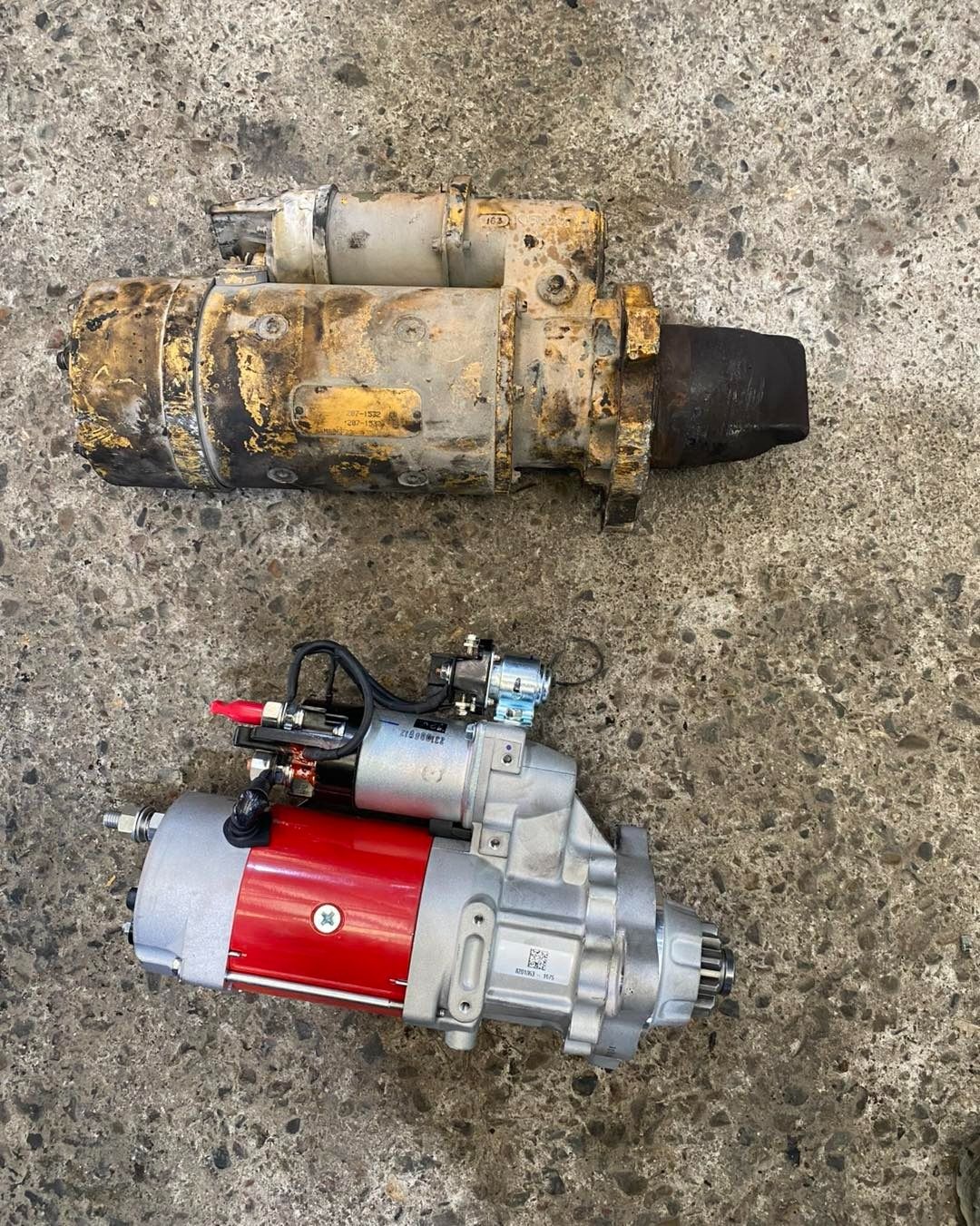 Two Mechanical Parts on a Concrete Surface