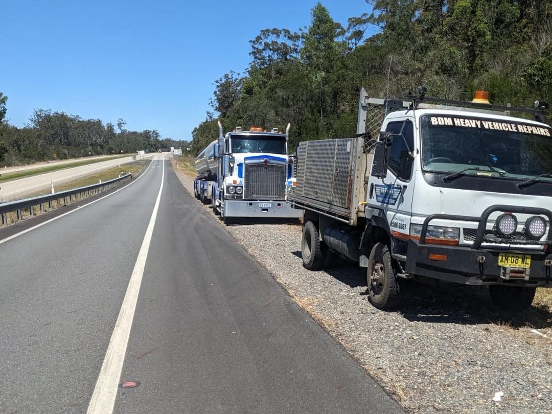 Two Trucks Are Parked on the Roadside
