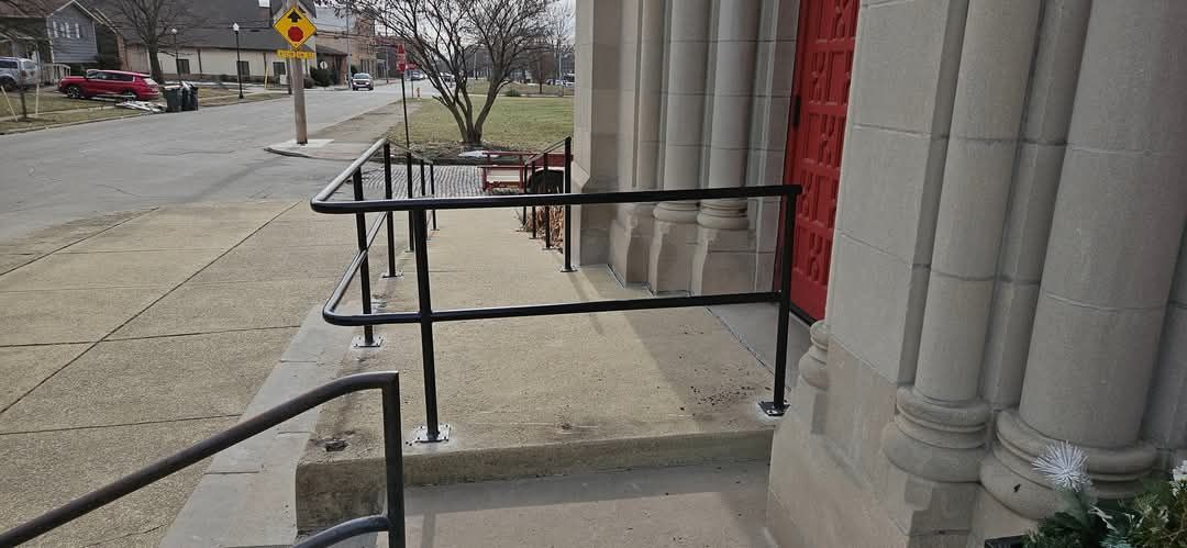 There is a railing on the side of a building.