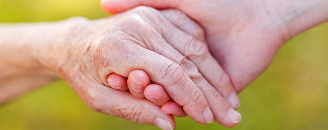 Caregiver Holds the Hands of Elderly — New York — Star One Home Care