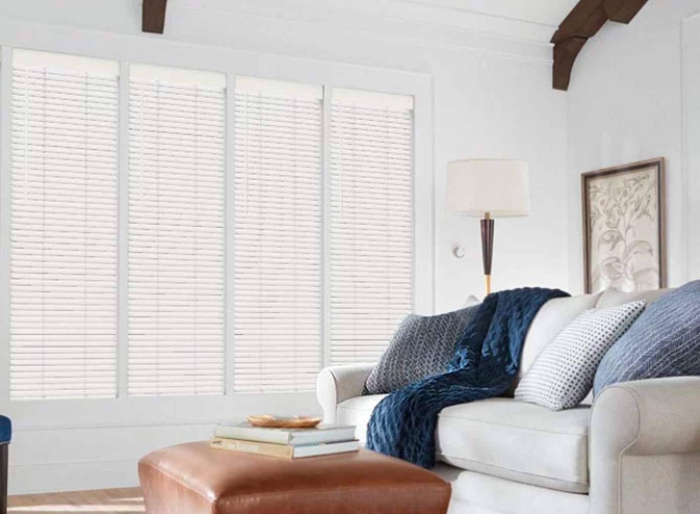 Hunter Douglas Parkland® Wood Blinds covering windows in a modern living room.