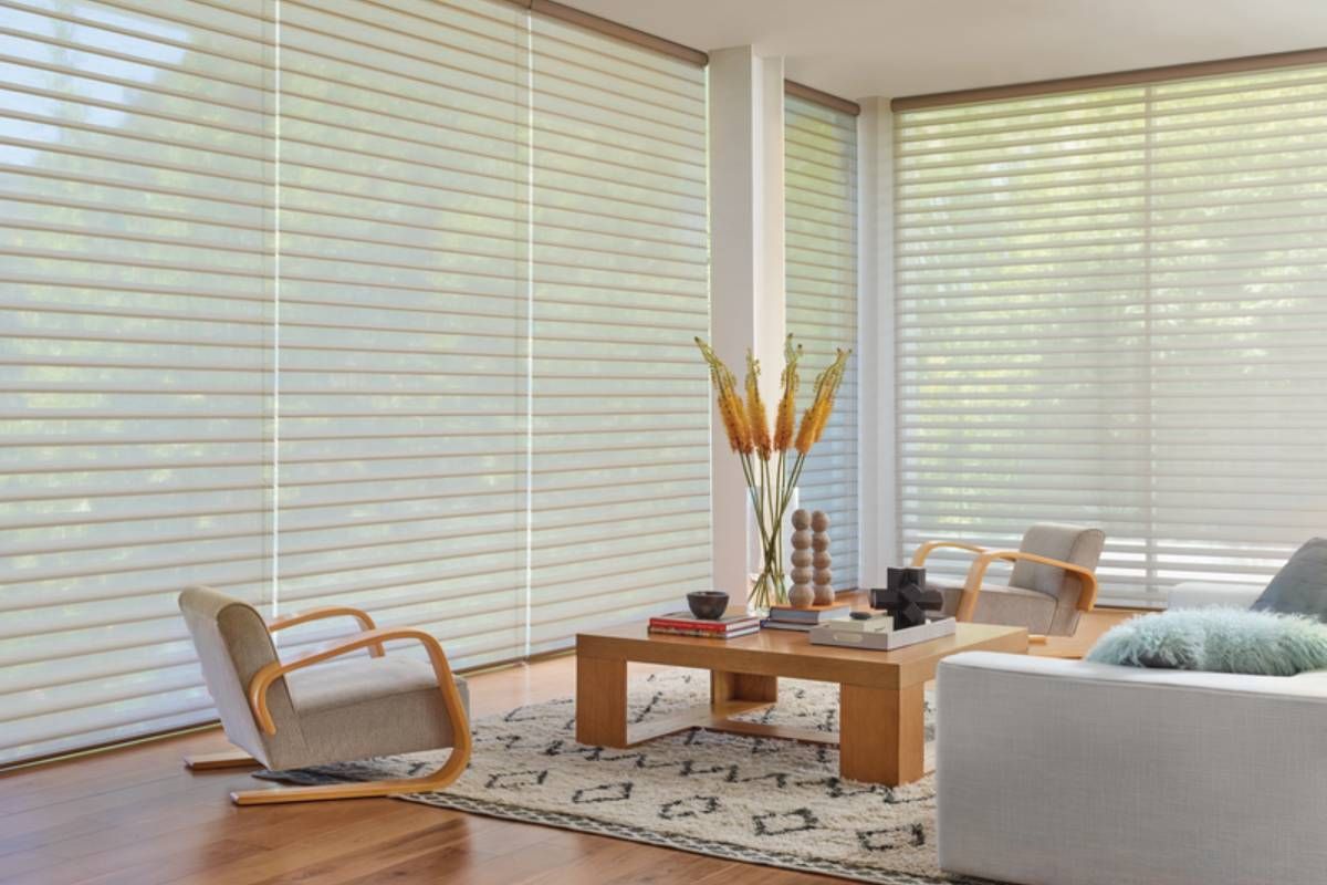 Bright and open living room equipped with Hunter Douglas blinds and PowerView® Automation at Window Magic Blind & Drapery near Houston, TX