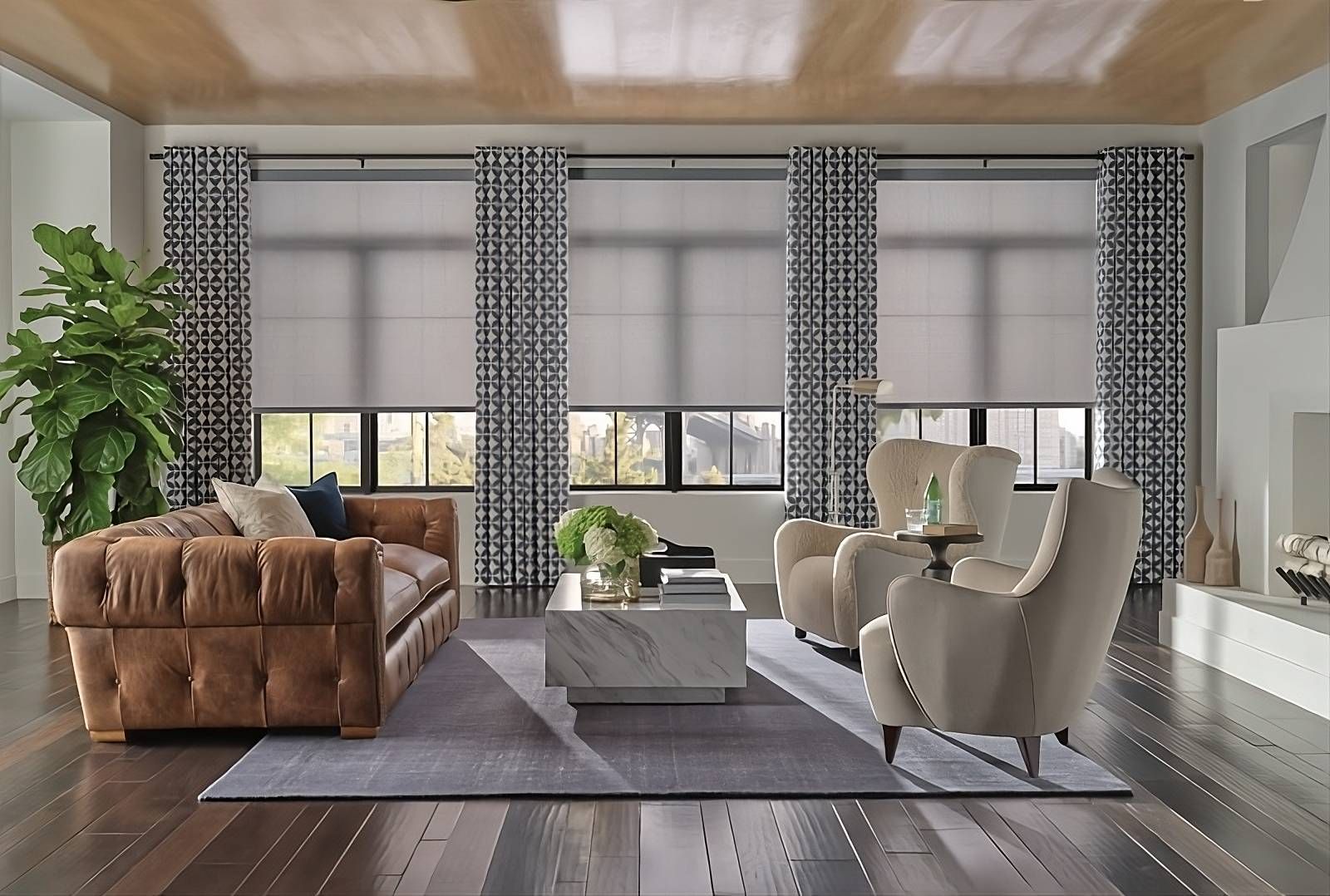 Hunter Douglas unique window treatments, roller shades paired with patterned drapery, in a living room at Window Magic Blinds & Drapery near Houston, TX