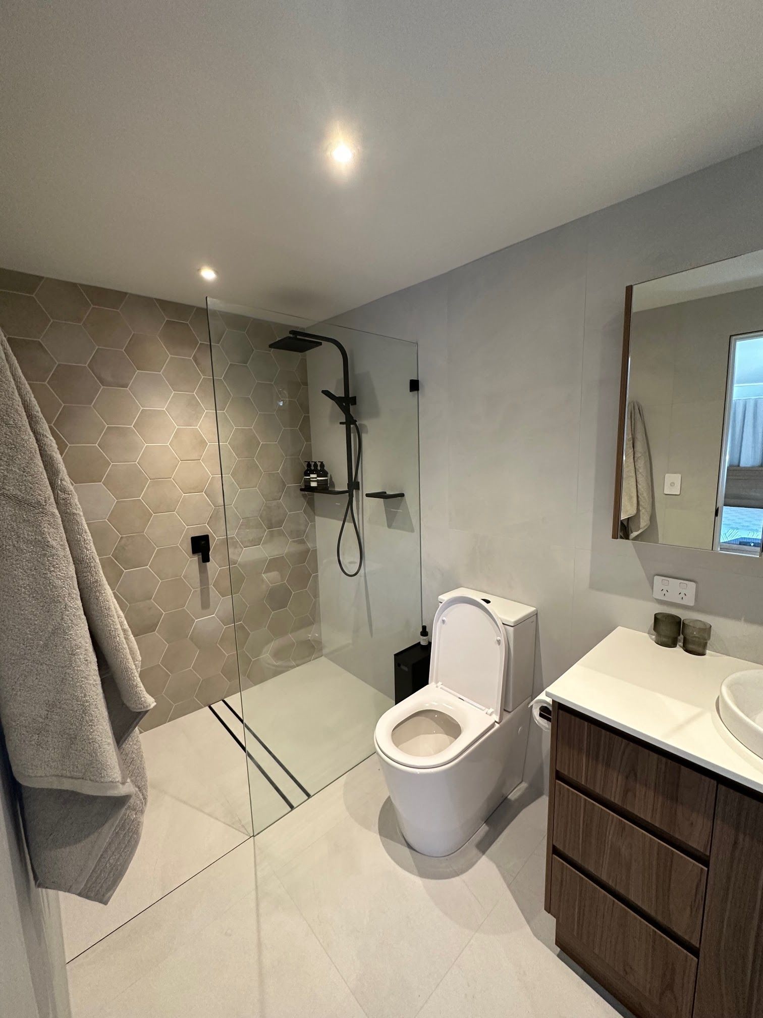Modern Bathroom With Walk-in Shower, Toilet, Vanity, and Large Mirror — Port Macquarie Plumbing In Port Macquarie, NSW