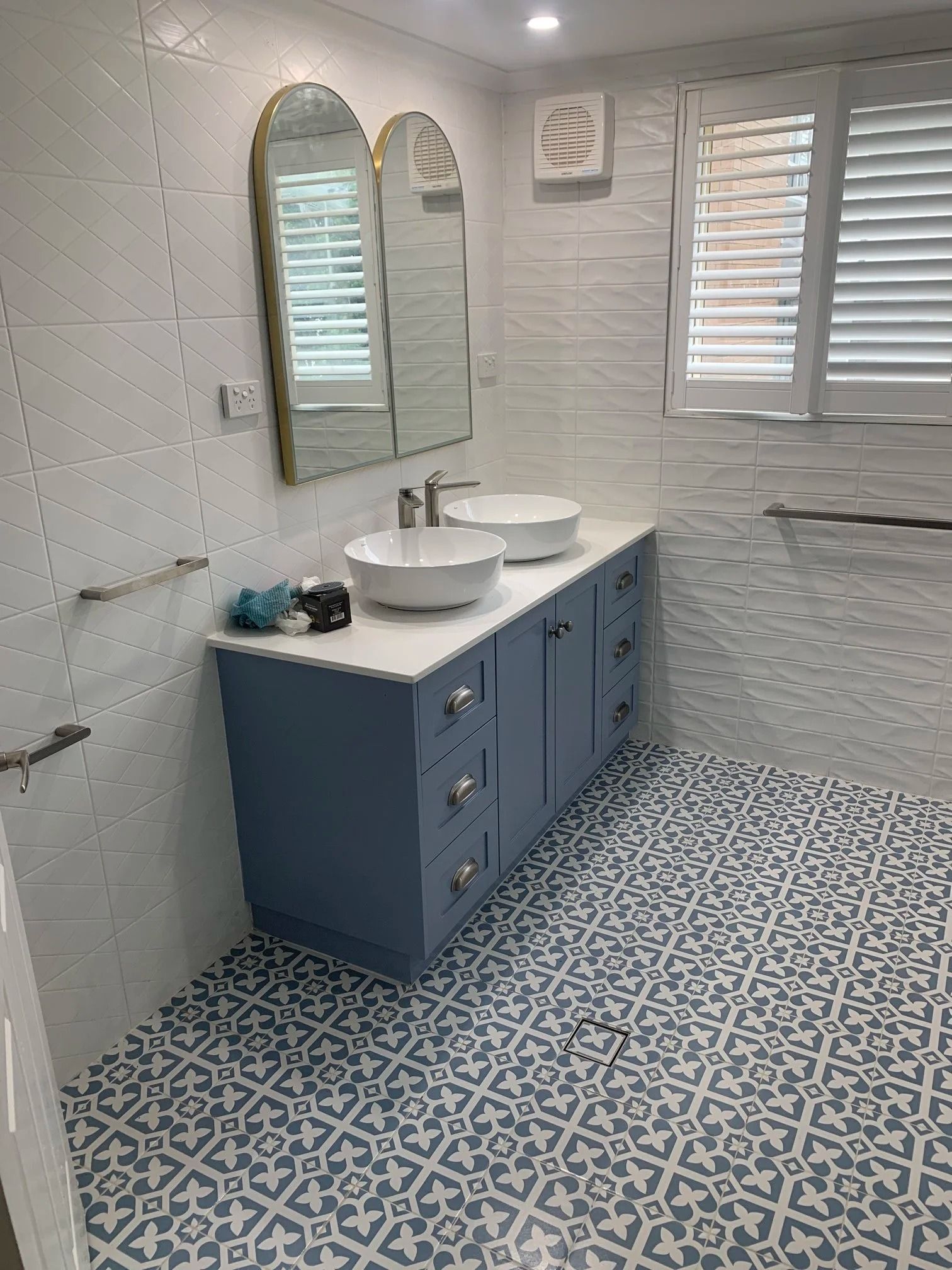 A Bathroom With a Blue Double Vanity — Port Macquarie Plumbing In Port Macquarie, NSW