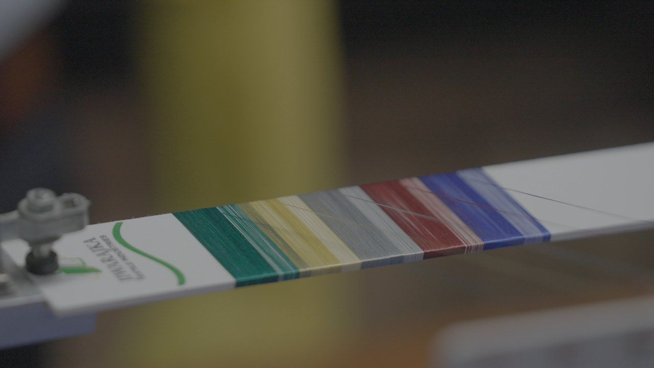 A close up of a piece of paper with a rainbow of colors on it.