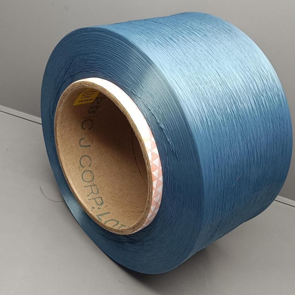 A bunch of blue spools are stacked on top of each other