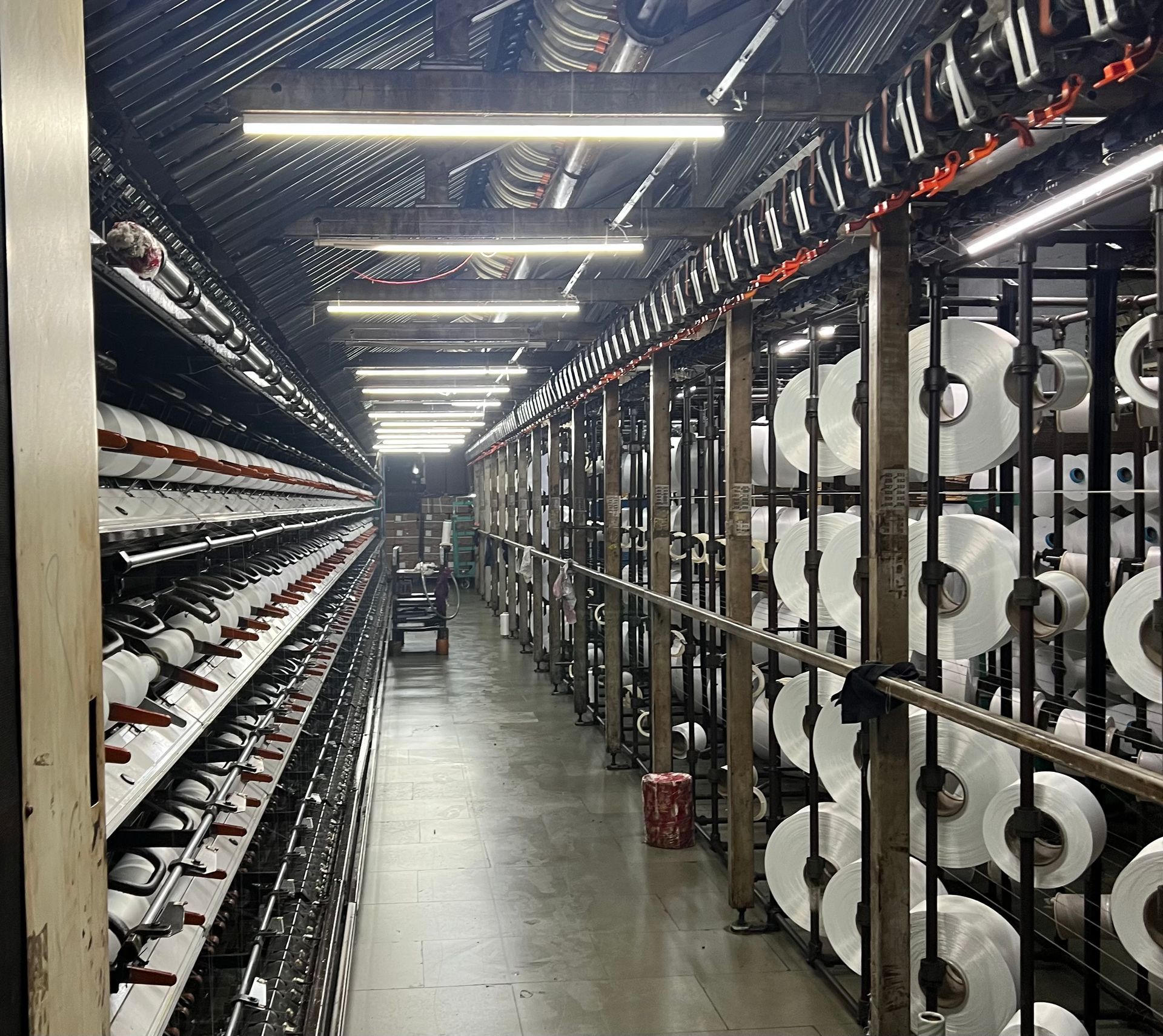 A warehouse filled with lots of rolls of paper