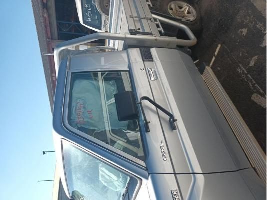 A Silver Truck With the Word Toyota on the Door — South West 4WD Wreckers In Harristown, QLD