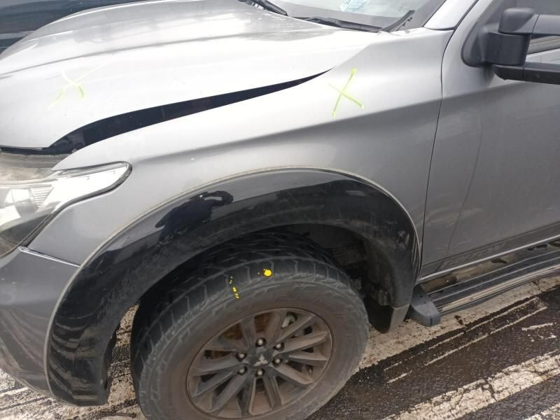 A Gray Truck With a Damaged Hood is Parked on the Side of the Road — South West 4WD Wreckers In Brisbane, QLD