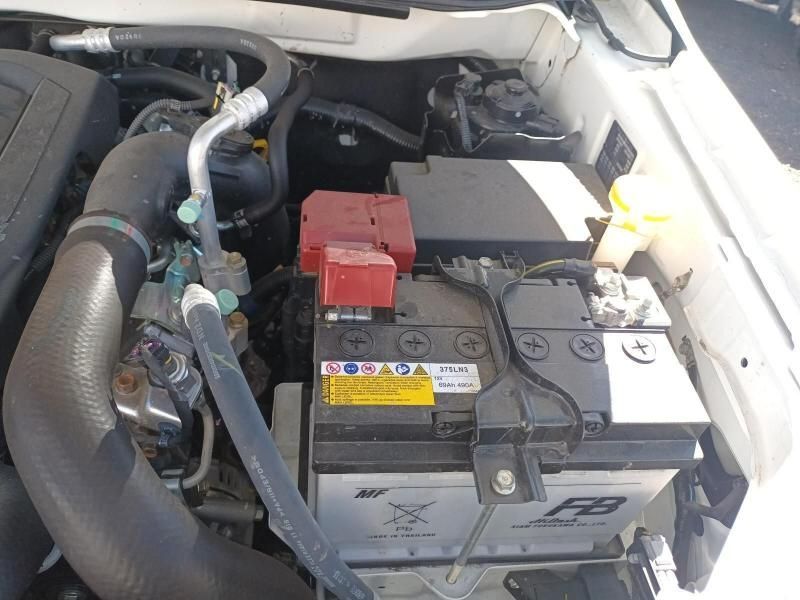 A White Car With a Black Battery in the Engine Compartment — South West 4WD Wreckers In Harristown, QLD