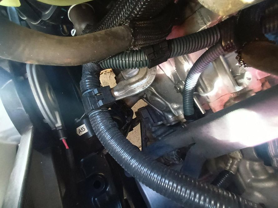 A Close Up of a Car Engine with Hose Attached to It — South West 4WD Wreckers in Harristown, QLD