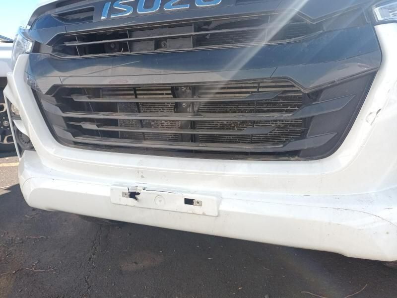 A White Isuzu Truck is Parked on the Side of the Road — South West 4WD Wreckers In Harristown, QLD
