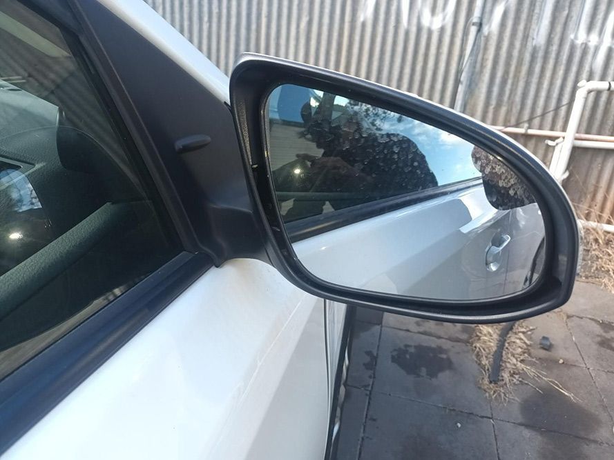 A Close Up of a Side View Mirror on a White Car — South West 4WD Wreckers in Harristown, QLD