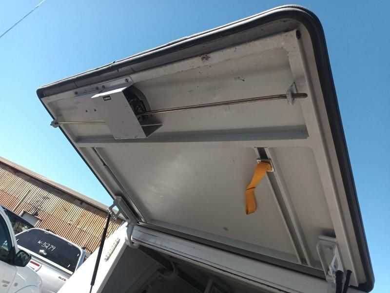 The Roof of a White Truck With the Door Open — South West 4WD Wreckers In Harristown, QLD