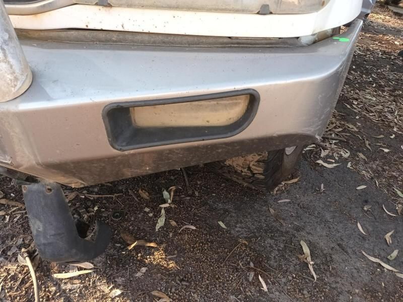 The Front Bumper of a Car is Sitting on the Ground — South West 4WD Wreckers In Harristown, QLD