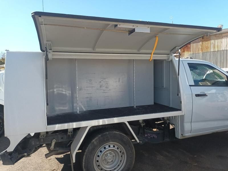 A White Truck With a Canopy on It is Parked in a Parking Lot — South West 4WD Wreckers In Harristown, QLD