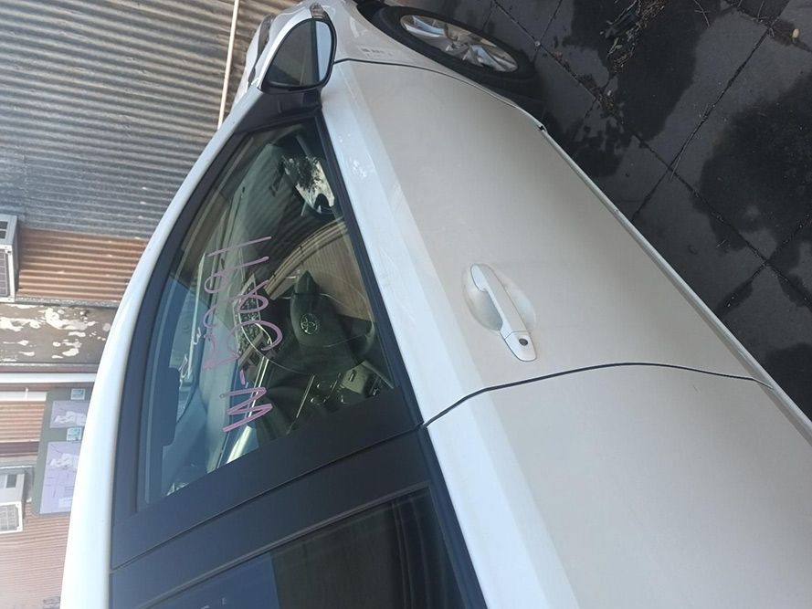 A White Car is Parked in Front of a Building — South West 4WD Wreckers in Harristown, QLD
