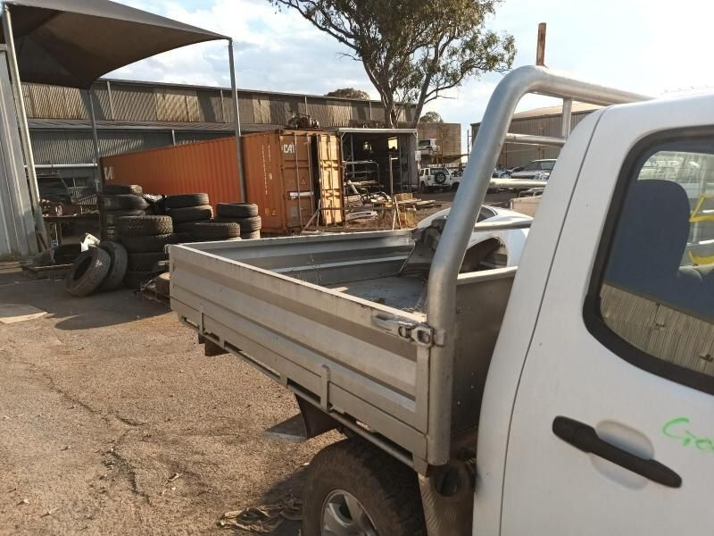 A White Truck is Parked in Front of a Pile of Tires — South West 4WD Wreckers In Harristown, QLD