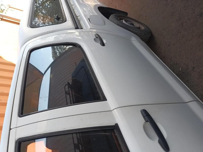 A White Truck is Parked on the Side of the Road — South West 4WD Wreckers In Harristown, QLD