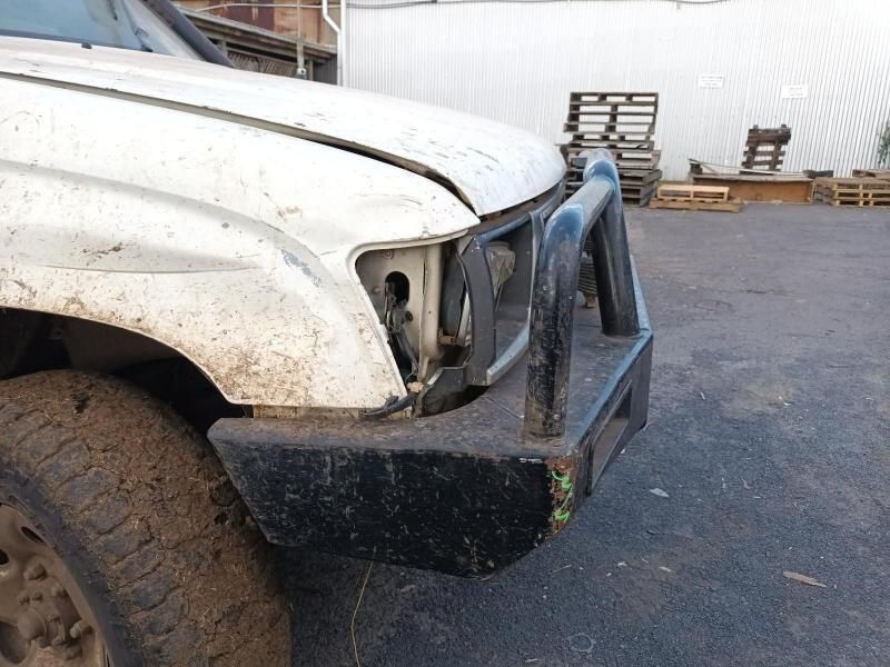 A White Truck With a Black Bumper is Parked in a Parking Lot — South West 4WD Wreckers In Brisbane, QLD