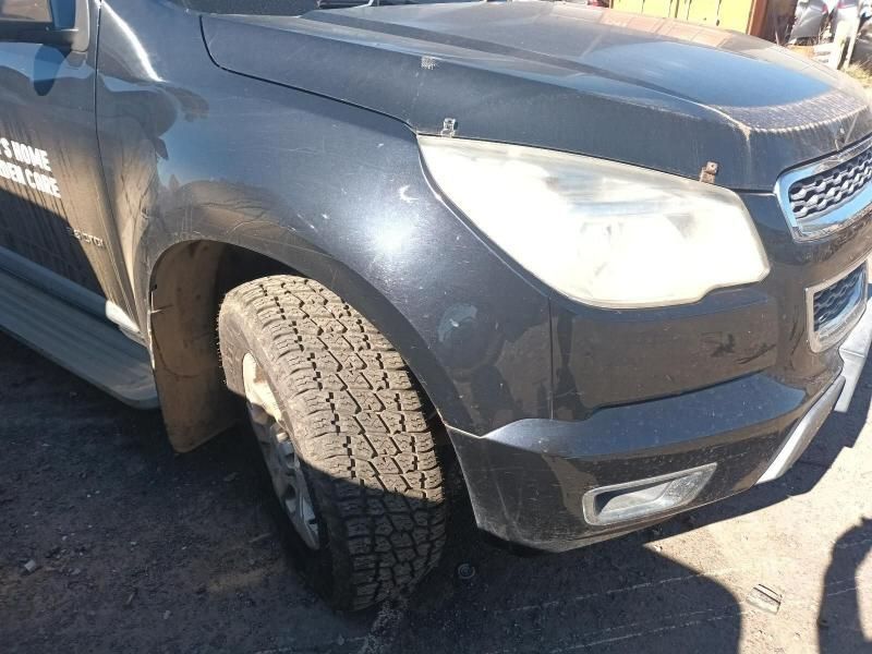 A Black Truck is Parked on the Side of the Road — South West 4WD Wreckers In Harristown, QLD