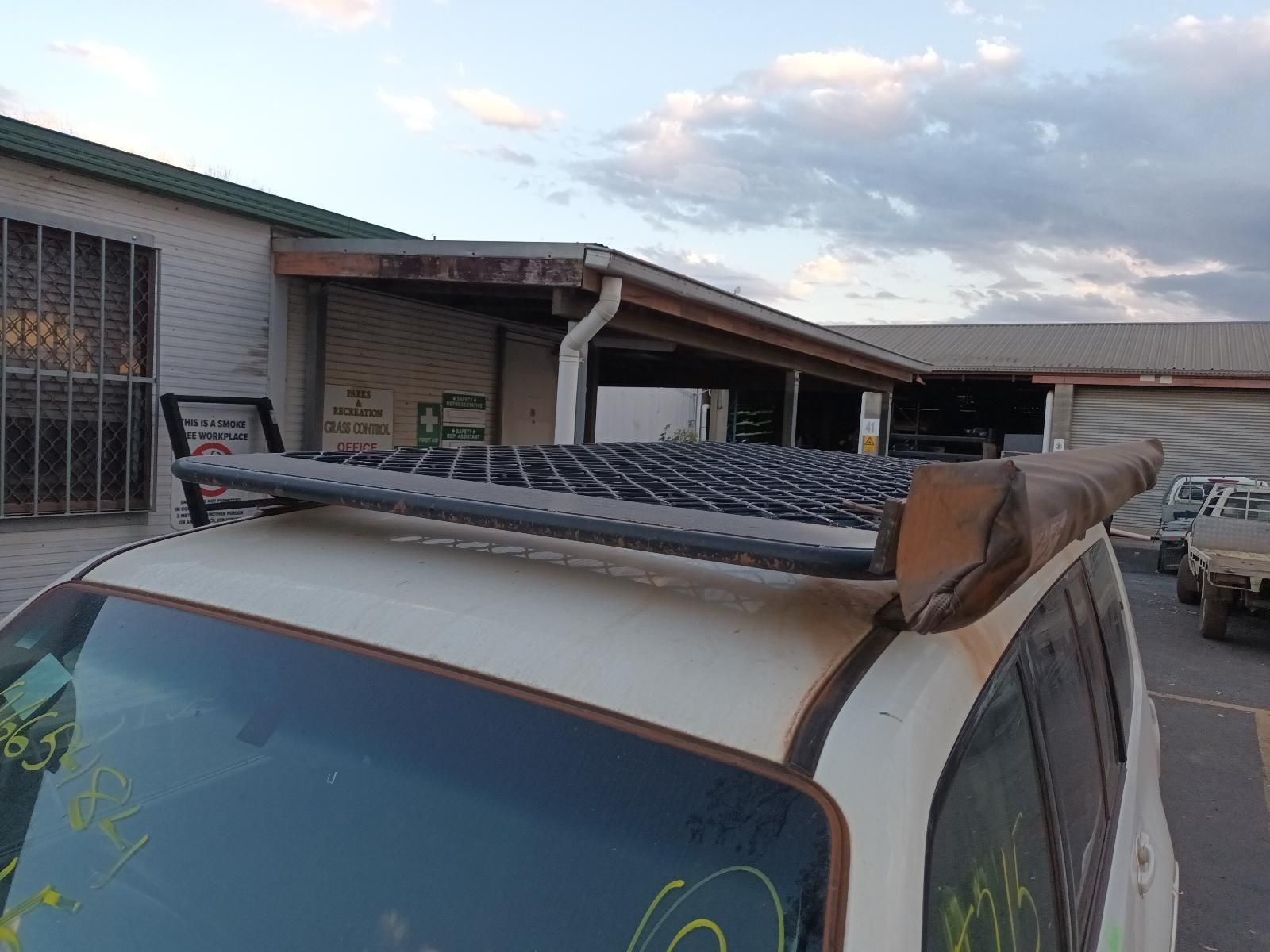 A White Van With a Roof Rack on Top of It — South West 4WD Wreckers In Brisbane, QLD