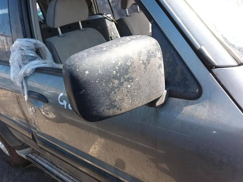 A Dirty Side Mirror on a Car With the Word G on It — South West 4WD Wreckers In Harristown, QLD