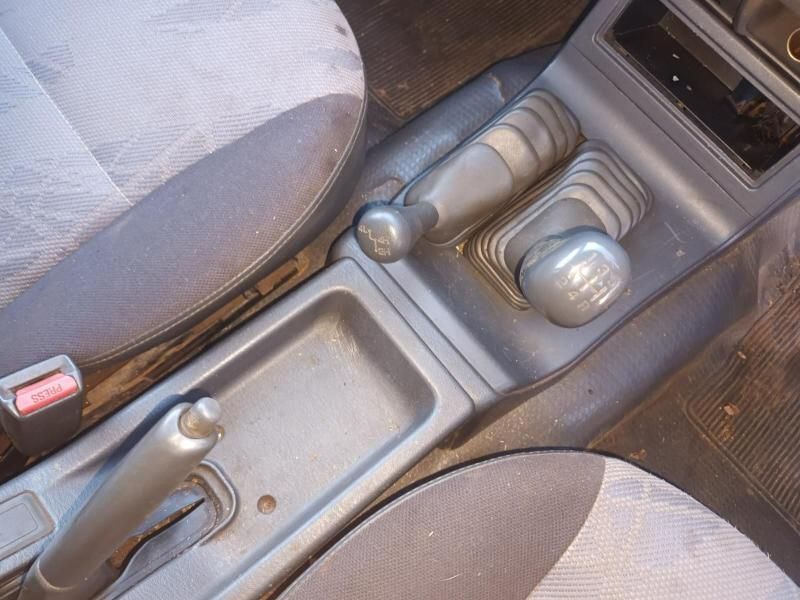 A Close Up of a Cars Shifter and Brake Levers — South West 4WD Wreckers In Brisbane, QLD