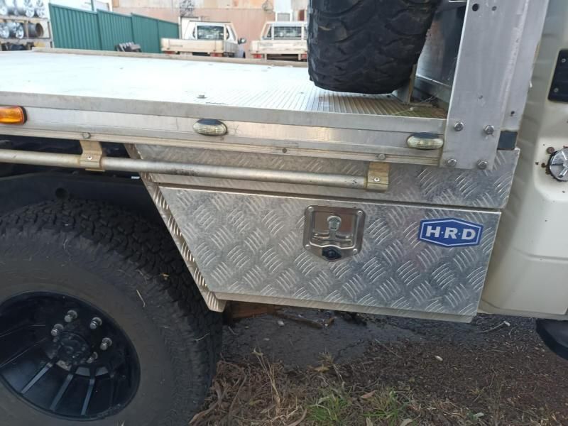 A Silver Truck With a Toolbox That Says Hrd on It — South West 4WD Wreckers In Brisbane, QLD