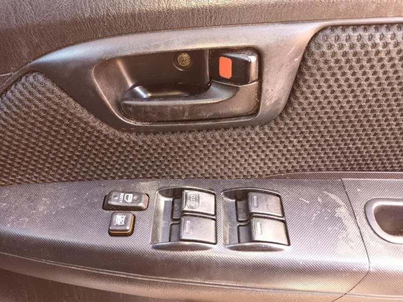 A Close Up of a Car Door With a Window Switch — South West 4WD Wreckers In Harristown, QLD