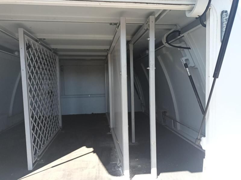 The Inside of a White Van With the Door Open and a Fence — South West 4WD Wreckers In Harristown, QLD