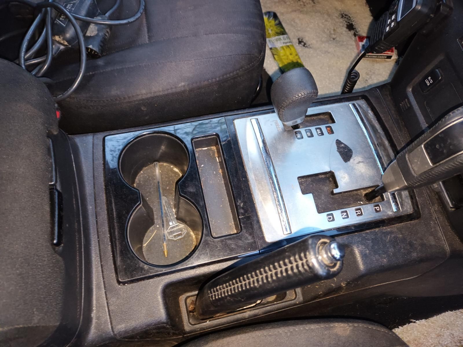 The Center Console of a Car With a Bottle of Beer in It — South West 4WD Wreckers In Brisbane, QLD