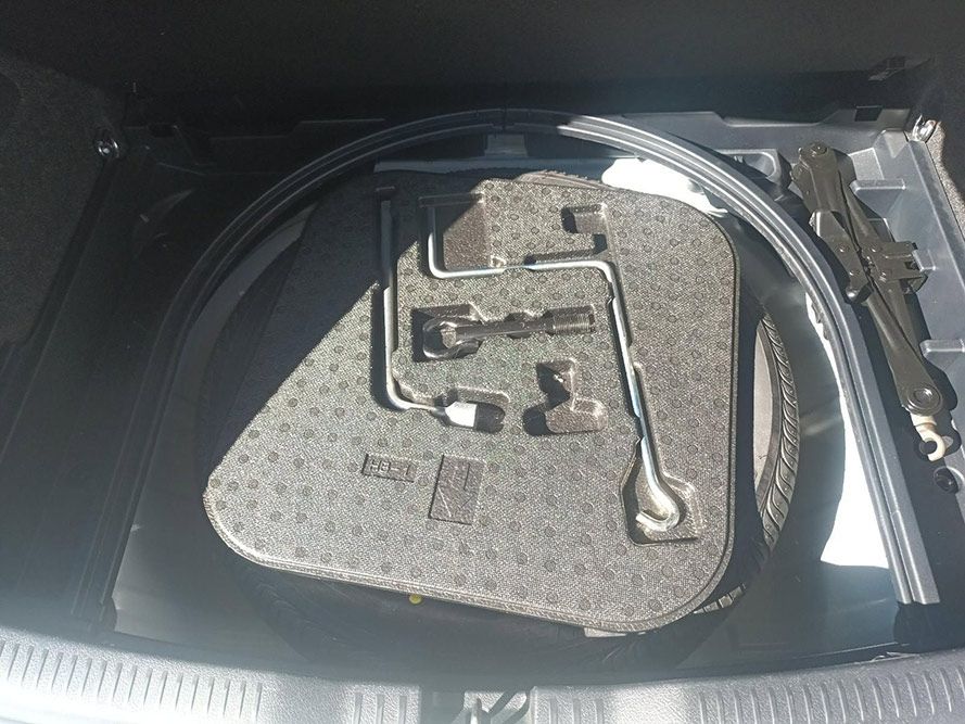 The Trunk of a Car is Filled with Tools and a Tire — South West 4WD Wreckers in Harristown, QLD