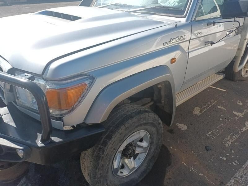A Silver Toyota Land Cruiser is Parked in a Parking Lot — South West 4WD Wreckers In Harristown, QLD